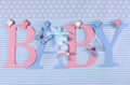 Pink and blue theme Baby bunting letters hanging from pegs on a line Royalty Free Stock Photo