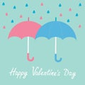 Pink and blue umbrellas. Rain in shape of hearts.