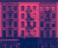 Pink and blue wall of windows on New York City buildings Royalty Free Stock Photo