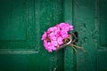 Pink bouquet on old door