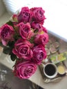 pink bouquet of small roses in the background coffee. Women& x27;s day