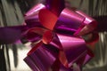 Pink bow on a gift. Gift wrap. Packing tape