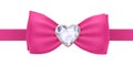Pink bow tie with heart diamond brooch.