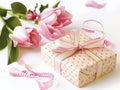 A pink box with a ribbon on top sits on a white background Royalty Free Stock Photo