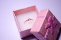 Pink box with a ring. Golden ring with a stone. Pink jewelry box. Ring for a gift. Bijouterie. Jewelry for girls. Jewelry Royalty Free Stock Photo