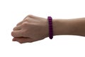 Pink bracelet mockup on a man`s hand. Empty layout of the design of wrist banners. Cheap bracelets, isolated.