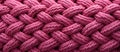 Pink braided rope texture background, close up. Basketwork