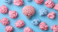Pink brain lightbulb surrounded by crumpled paper on blue background Royalty Free Stock Photo