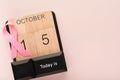 Pink Breast Cancer Awareness Ribbon. Wooden calendar with pink ribbons on backgrounds. Breast cancer awareness and October Pink da Royalty Free Stock Photo