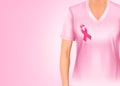 Pink breast cancer awareness shirt and ribbon. Royalty Free Stock Photo