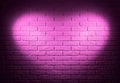 Pink brick wall with heart shape light effect and shadow, abstract background photo Royalty Free Stock Photo