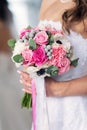 Pink bridal bouquet in hands