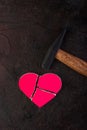 Pink broken stone heart and hammer Royalty Free Stock Photo