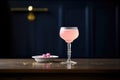 pink bubbly drink, bright light, dark corner