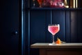 pink bubbly drink, bright light, dark corner