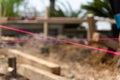 Pink builders string-line closeup on constructions site in selective focus Royalty Free Stock Photo