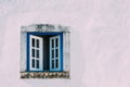 Pink building with white-blue beautiful window with ornaments in Obidos, Portugal Royalty Free Stock Photo
