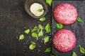 Pink buns for the vegetable Burger on the basis of beet with sesame seeds on dark background. Top view Royalty Free Stock Photo