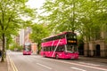 Pink bus in Victorian Street in central Belfast