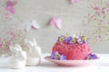 Pink buttercream cake with flowers to easter Royalty Free Stock Photo