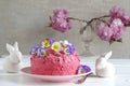 Pink buttercream cake with flowers to easter Royalty Free Stock Photo