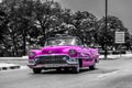 Pink cabriolet classic car on the Malecon in Cuba Havana