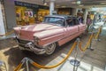 Pink 1956 Cadillac at the airport