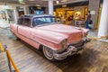 Pink 1956 Cadillac at the airport