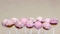 Pink cake pops on grey background Royalty Free Stock Photo