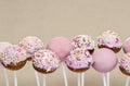 Pink cake pops on grey background Royalty Free Stock Photo