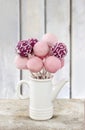 Pink cake pops on wooden table Royalty Free Stock Photo