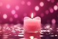 Pink candle on water