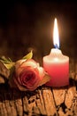 Pink Candle And White Rose On Rustic Wood Royalty Free Stock Photo