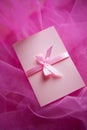 Pink cardboard with satin bow