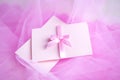 Pink cardboard with satin bow