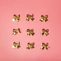 Pink celebration background with golden bows