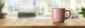 Pink Ceramic Coffee Mug on a Wooden Table in Blurred Light Modern Office Interior, 3D Render Royalty Free Stock Photo