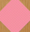 Pink Checkered Tablecloth on Brown Oak Wooden Table