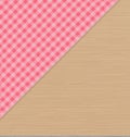 Pink Checkered Tablecloth on Light Brown Wooden Table