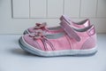 Fashion baby pink sandals with pink flowers.Baby Kid`s modern sneakers shoe on white background. A pair of pink Royalty Free Stock Photo