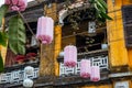 Pink chinese lantern on thread. Hoi An Vietnam city view. Vietnamese traditional decor. Paper lantern row