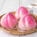 Pink Chinese peach birthday bun food on white table background Royalty Free Stock Photo