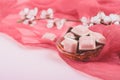 Pink chocolate bar and white flower on pink and red background. Ruby new chocolate. New pink sweet dessert Royalty Free Stock Photo