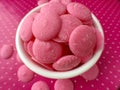 Pink Chocolate Candy Melts on pink polka dots Background Royalty Free Stock Photo