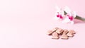 Pink chocolate and orhid on pink background. Ruby new chocolate. New pink sweet dessert Royalty Free Stock Photo