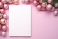 Pink Christmas background with blank paper and decorations on a pink background. Royalty Free Stock Photo