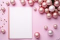 Pink Christmas background with blank paper and decorations on a pink background. Royalty Free Stock Photo