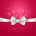 Pink Christmas background with white silk bow