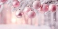 Pink Christmas banner with tree bauble ornaments and snow covered tree Royalty Free Stock Photo