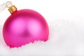 Pink Christmas bauble on snow Royalty Free Stock Photo